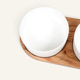 Charger l'image dans la visionneuse de la galerie, Patomia Barcelona double dog bowl set with white ceramic bowls on a light oiled oak wood base.