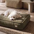 Charger l'image dans la visionneuse de la galerie, Patomia Cuadra green corduroy dog bed with a fluffy white dog resting on it in a cozy living room setting