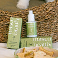 Charger l'image dans la visionneuse de la galerie, Patomia Masco Beauty natural eye cleanser for dogs and cats in a green bottle and box with a pet paw in the background