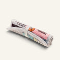 Charger l'image dans la visionneuse de la galerie, Patomia newspaper-shaped dog toy that unfolds into a soft fabric snuffle mat for hiding treats.