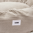 Charger l'image dans la visionneuse de la galerie, Patomia Nuba beige corduroy dog bed with a soft, textured fabric cover and a branded label on the side.