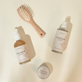 Charger l'image dans la visionneuse de la galerie, Patomia Pawness dog grooming set with Fresh Fetch spray, shampoo, wooden brush, and Cuddle Cure balm on beige surface