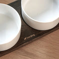 Charger l'image dans la visionneuse de la galerie, Patomia Barcelona double dog bowl with a dark smoked oak wooden base and two white ceramic bowls
