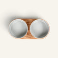 Charger l'image dans la visionneuse de la galerie, Patomia Barcelona double dog bowl with an oiled oak wood base and two grey ceramic bowls, top view.
