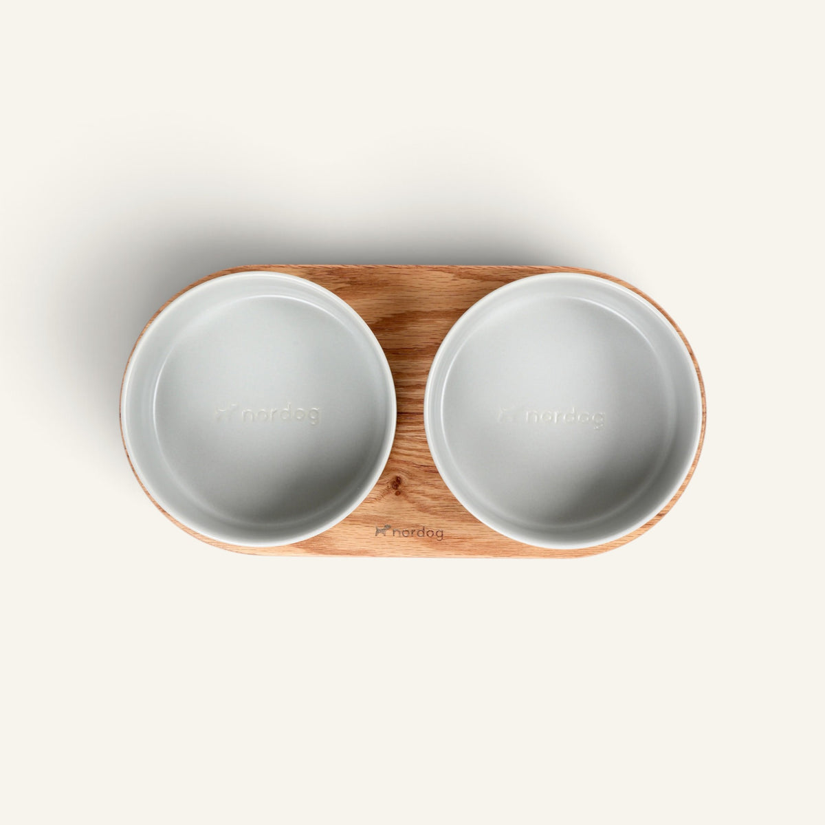 Patomia Barcelona double dog bowl with an oiled oak wood base and two grey ceramic bowls, top view.