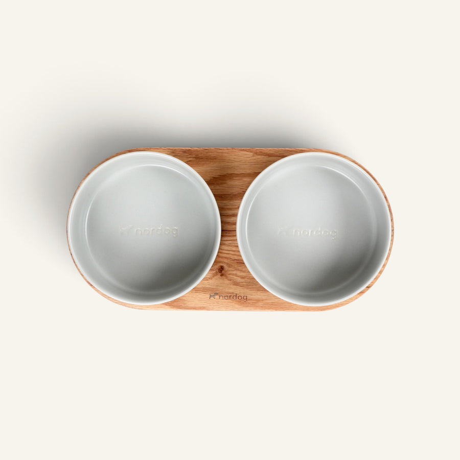 Patomia Barcelona double dog bowl with an oiled oak wood base and two grey ceramic bowls, top view.