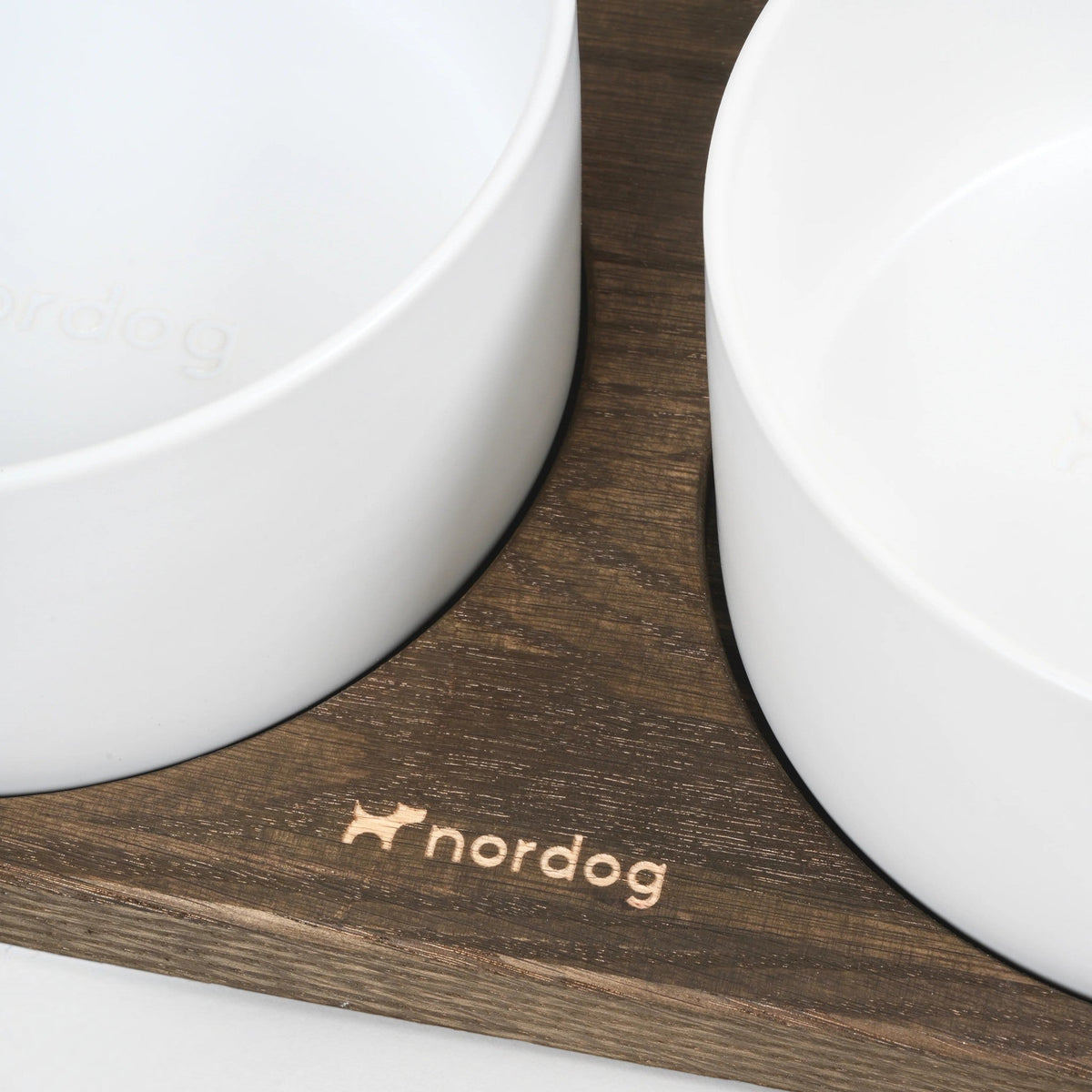 Patomia Barcelona double dog bowl set with white ceramic bowls on a dark smoked oak wooden base