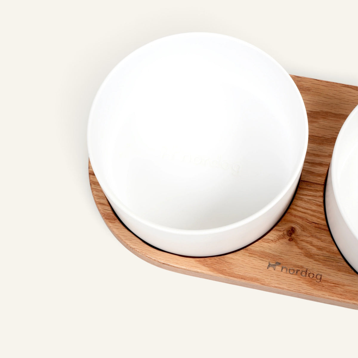 Patomia Barcelona double dog bowl set with white ceramic bowls on a light oiled oak wood base.
