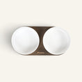 Charger l'image dans la visionneuse de la galerie, Patomia Barcelona double dog bowl with a dark smoked oak base and two white ceramic bowls, top-down view.

