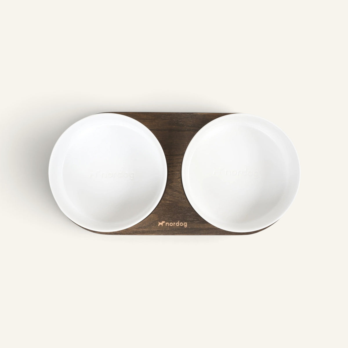 Patomia Barcelona double dog bowl with a dark smoked oak base and two white ceramic bowls, top-down view.
