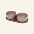 Charger l'image dans la visionneuse de la galerie, Patomia Barcelona double dog bowl with a dark smoked oak base and two mocha ceramic bowls on a light background.
