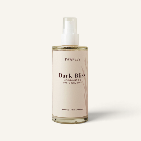 Patomia Bark Bliss natural dog conditioning spray in a clear bottle with a minimalist label for coat hydration.