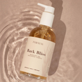 Charger l'image dans la visionneuse de la galerie, Patomia Bark Bliss natural nourishing and moisturizing dog shampoo in a 250ml pump bottle on a water-rippled surface.
