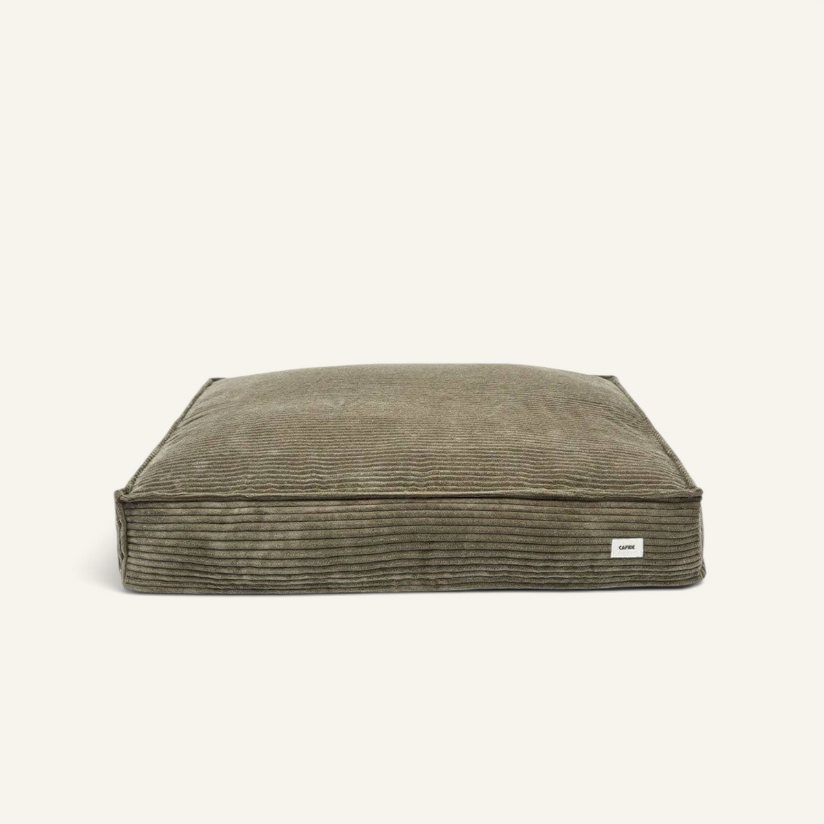 Patomia Cuadra green corduroy dog bed with a soft, removable cover and recycled foam filling.