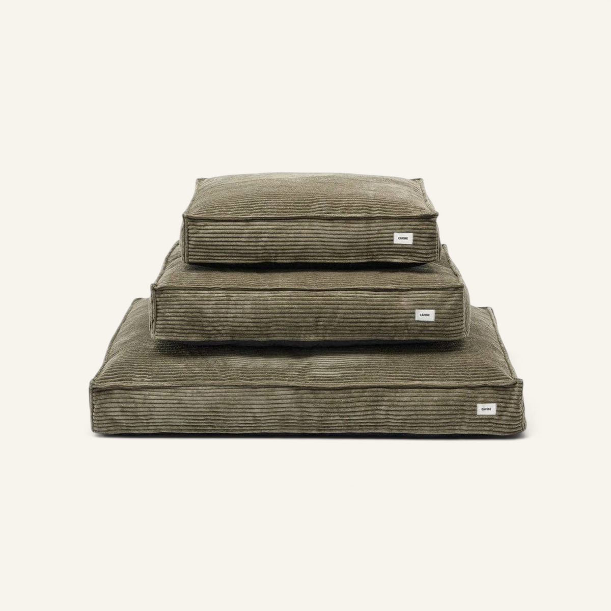 Patomia Cuadra green corduroy dog bed cushions stacked in three sizes with soft texture and minimalist design