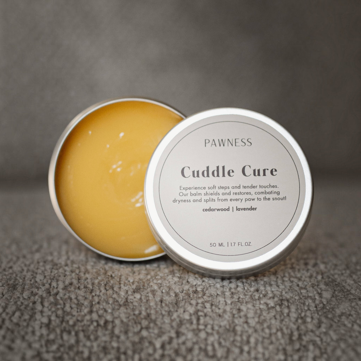 Patomia Cuddle Cure dog balm in a 50ml tin with lavender and cedarwood for soothing dry paws and noses.