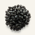 Charger l'image dans la visionneuse de la galerie, Patomia Daisy natural charcoal digestive dog treats in a small dark pile on a light background
