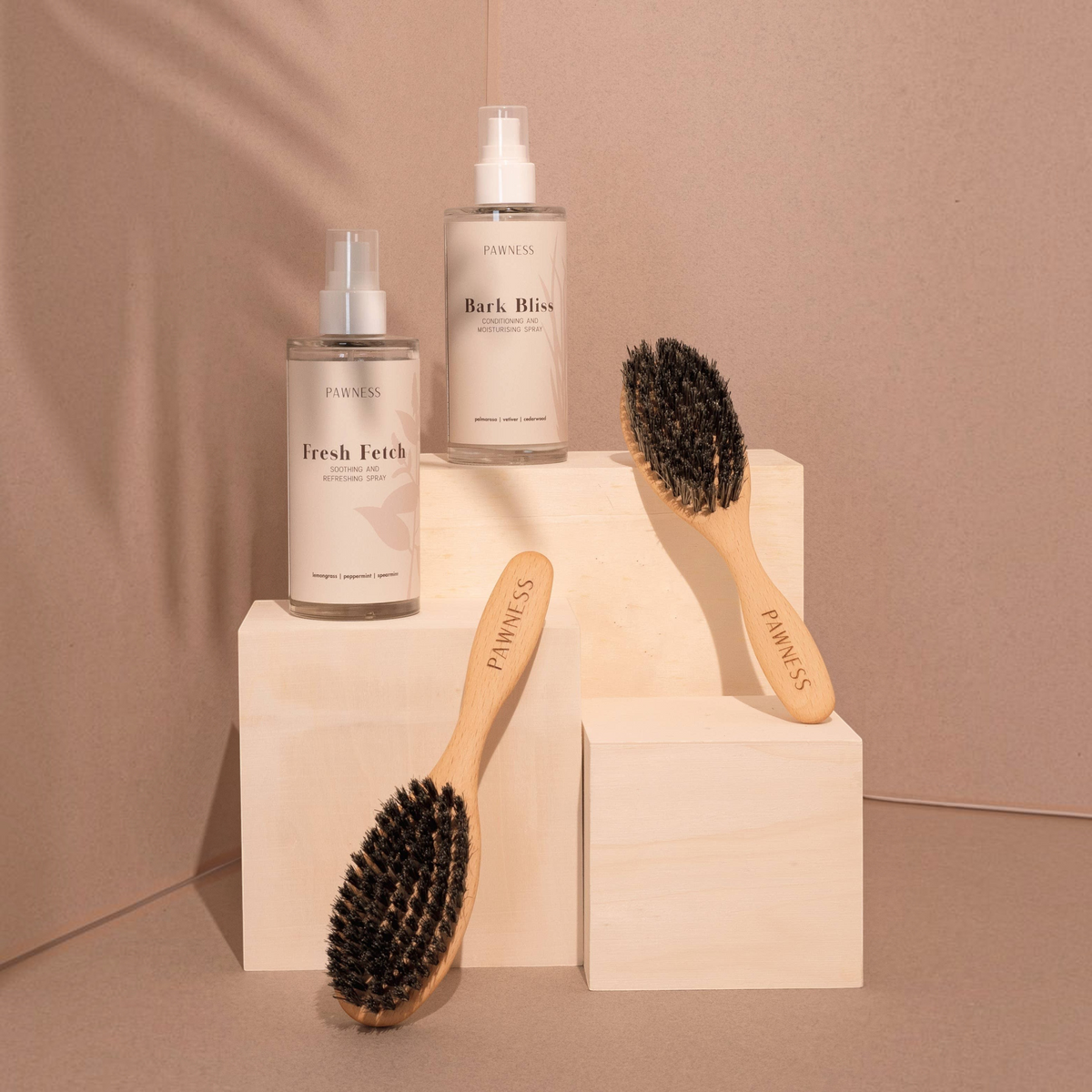 Patomia dog grooming brushes with natural Tampico bristles and beech wood handles displayed with grooming sprays