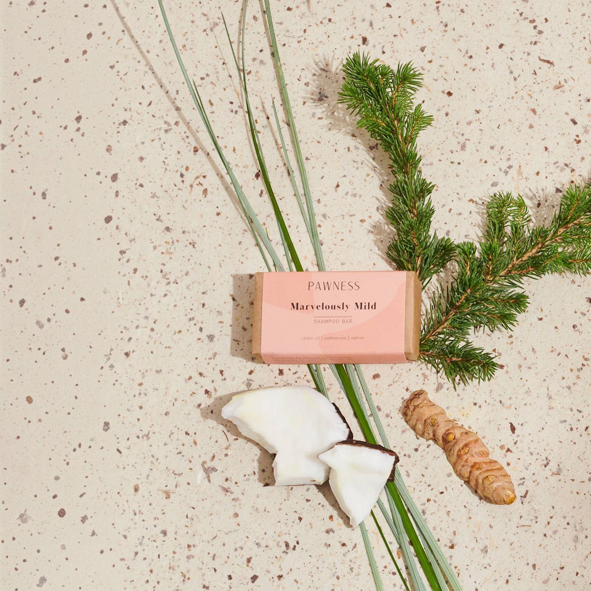 Patomia dog shampoo bar with cocoa butter, coconut, and essential oils on a speckled surface with natural botanicals.
