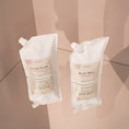 Charger l'image dans la visionneuse de la galerie, Patomia Bark Bliss and Fresh Fetch dog shampoo refill pouches on a reflective surface
