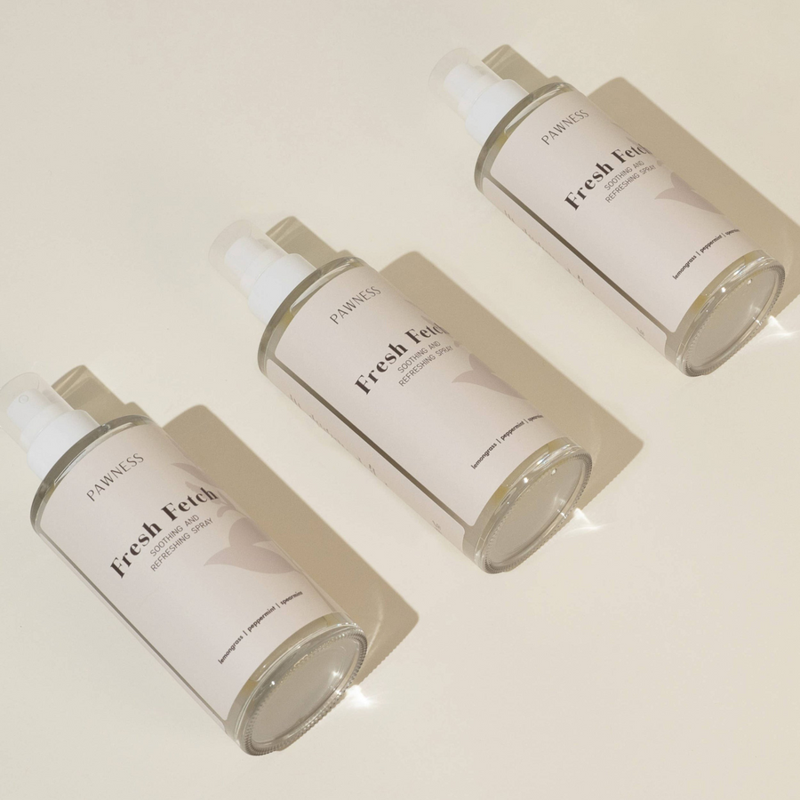 Three bottles of Patomia Fresh Fetch natural dog grooming spray with lemongrass, peppermint, and spearmint scents.