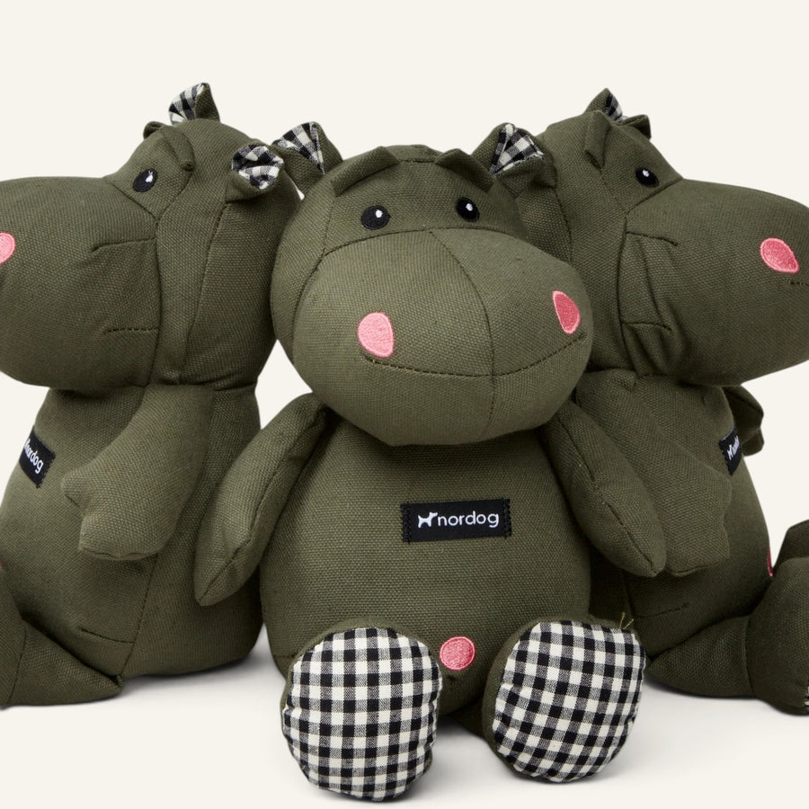 Patomia Henny olive green plush hippopotamus dog toy with black and white checkered accents on ears and feet.