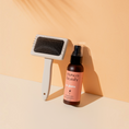 Charger l'image dans la visionneuse de la galerie, Patomia Masco Beauty professional dog grooming brush and detangling spray bottle on a beige background
