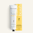 Charger l'image dans la visionneuse de la galerie, Patomia natural paw cream for dogs in a white tube and yellow box to soothe and repair dry, irritated skin.
