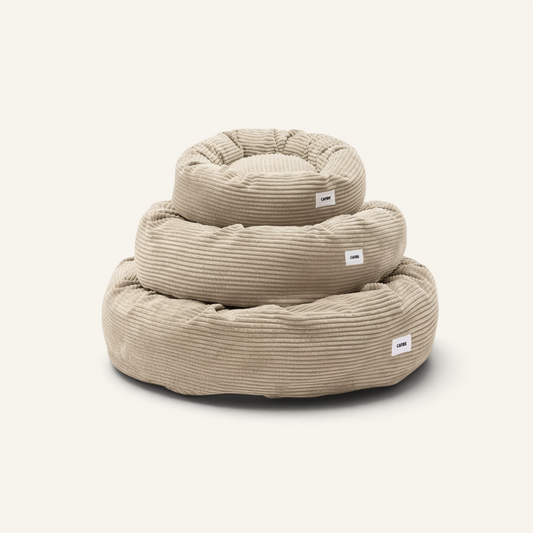 Patomia Nuba beige corduroy dog bed set in three sizes stacked on a plain background