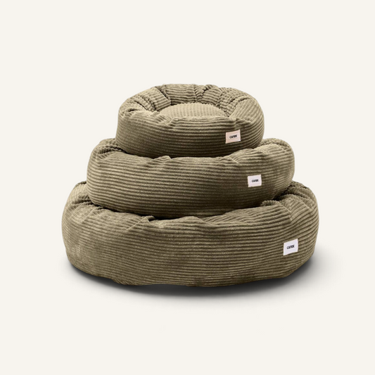 Patomia Nuba green corduroy dog bed set in three sizes stacked on a light background