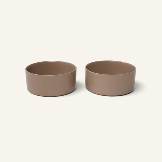 Two Patomia Oli Cacao ceramic dog bowls in a minimalist brown finish, designed for durable and stylish pet feeding.