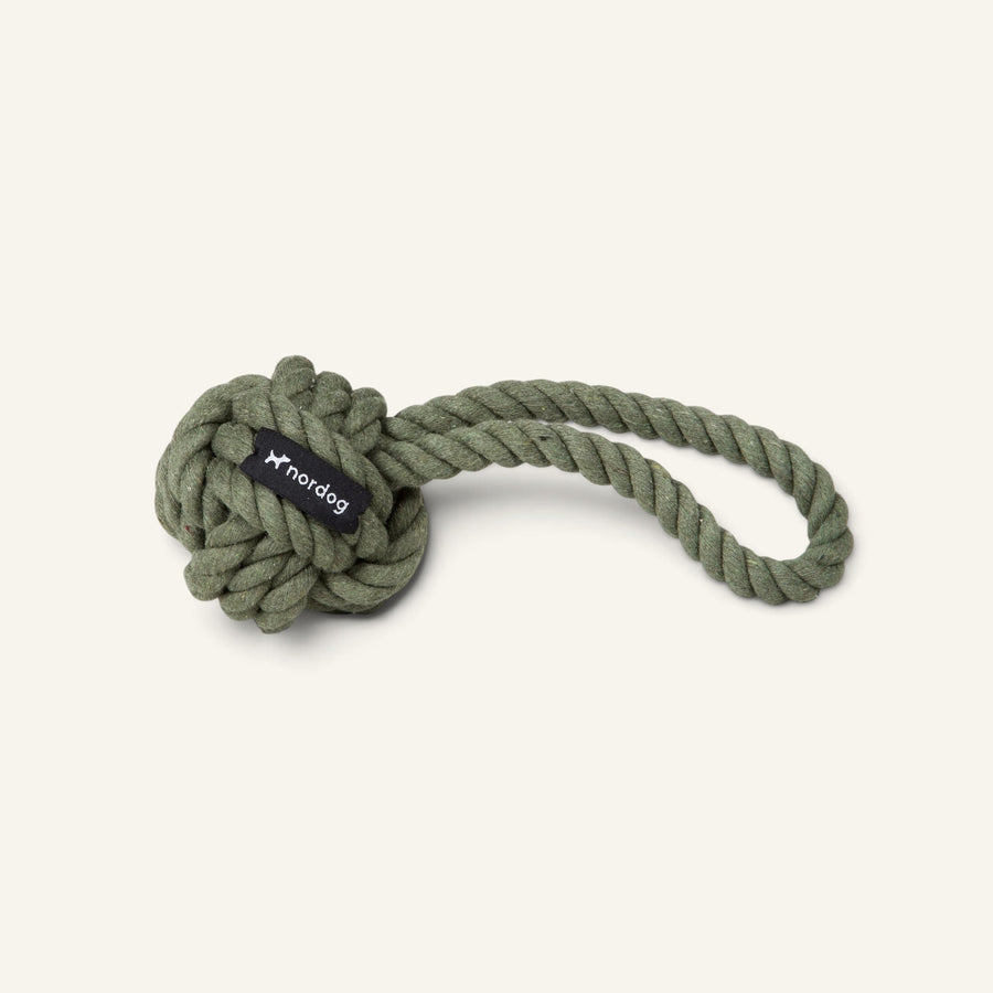 Patomia olive green organic cotton rope dog toy with a knotted ball and handle for interactive play