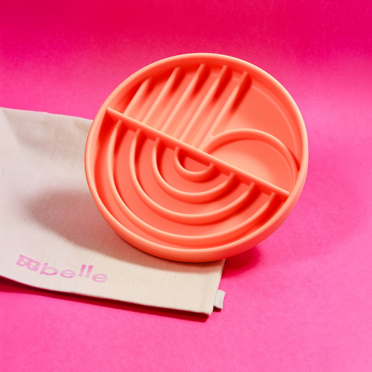 Patomia The Dreamy round orange silicone lickmat with arch patterns for pet enrichment on a pink background