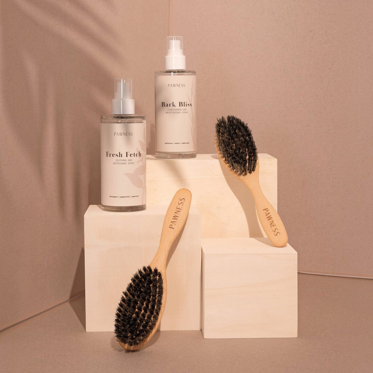 Patomia Pawness dog grooming set with Bark Bliss conditioning spray, Fresh Fetch refreshing spray, and two brushes.