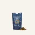 Charger l'image dans la visionneuse de la galerie, Patomia Plancton tuna fish treats for dogs and cats in a blue resealable pouch with crunchy snacks in front.
