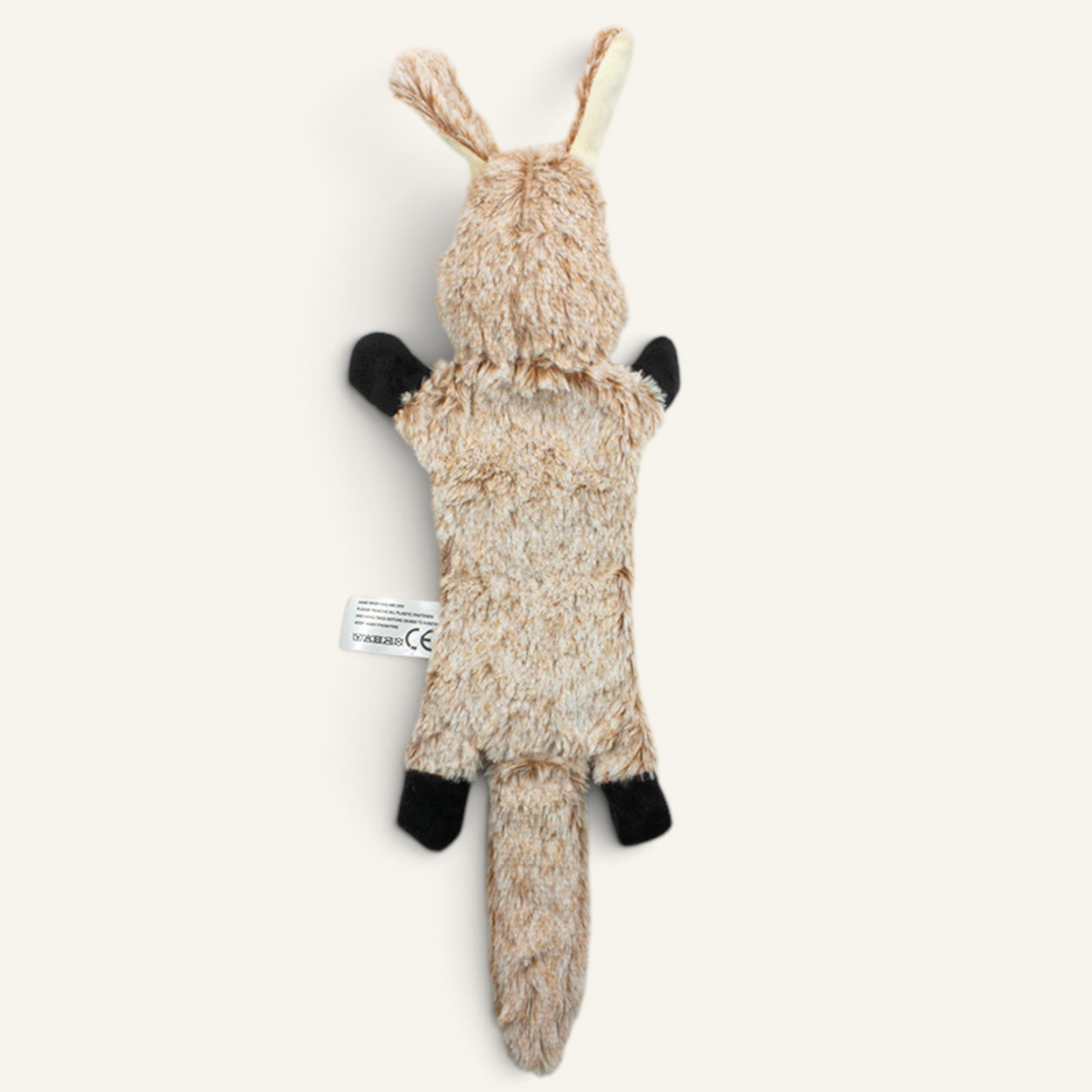Patomia plush rabbit dog toy with soft beige fur, black paws, and internal squeaker for interactive play.