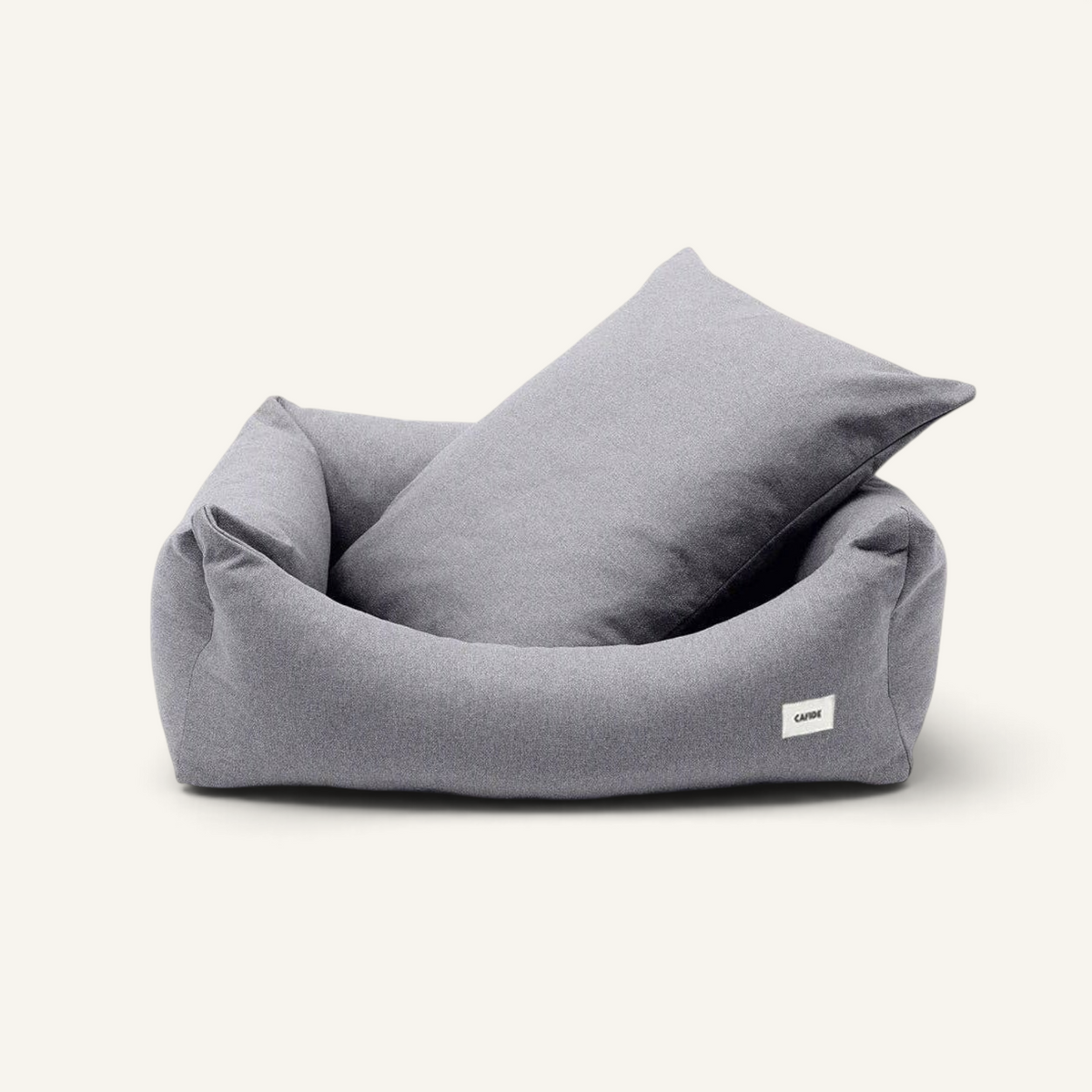 Patomia Snozy grey dog bed with soft fabric, removable cover, and adjustable recycled foam padding.