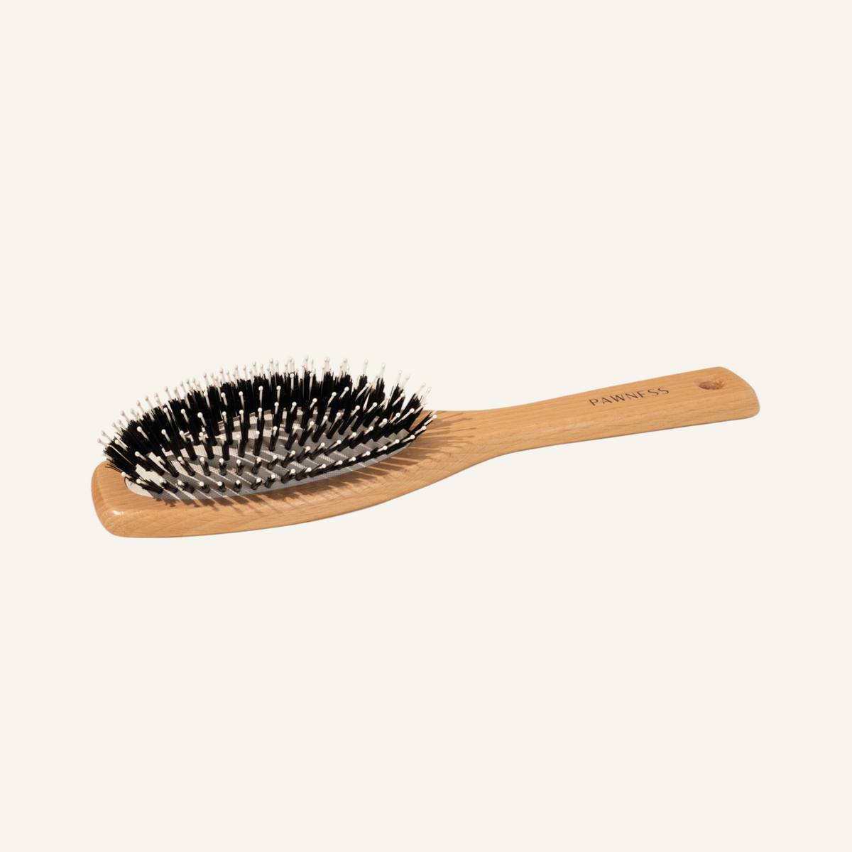 Patomia Pawness wooden dog brush with nylon bristles for short-haired dogs, featuring a sustainable beech wood handle.